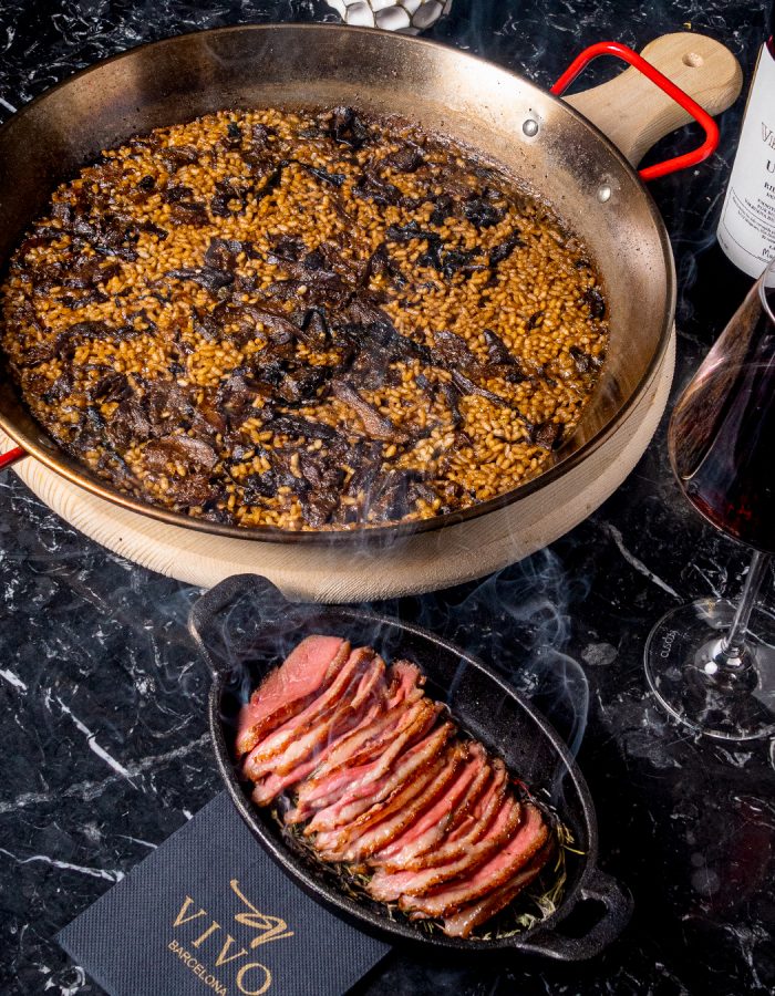 Paella a banda de setas con pato